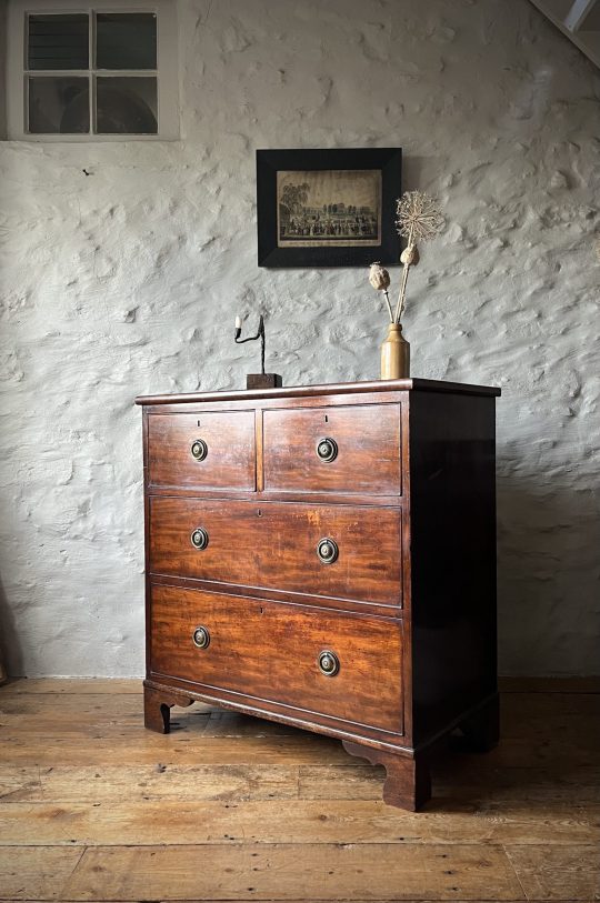 A small mahogany chest of drawers