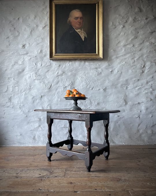 A 17th century oak centre table of rare small size