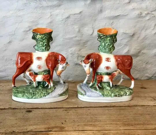 Pair of Staffordshire cow & calf spill vases Sold