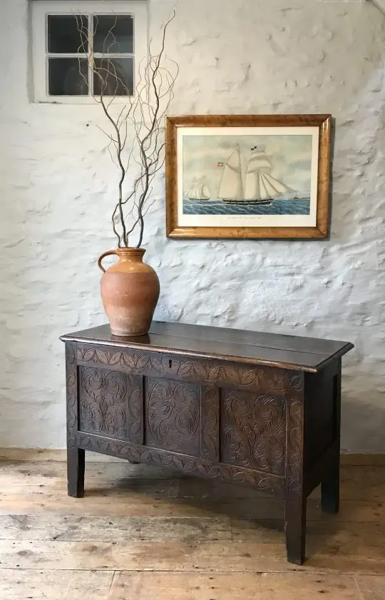A carved West Country oak chest Sold